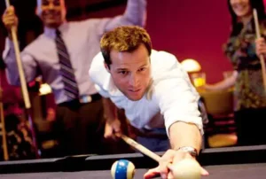 Playing billiards at Main Event. Family fun and entertainment