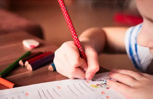 Children's Home Care ABA Therapy; Child writing on paper