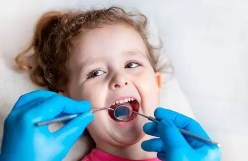 Child getting dental check up at Memorial Pediatric Dentistry; pediatric and family dentists
