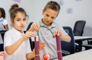 Two students at LIH collaborating on an experiment