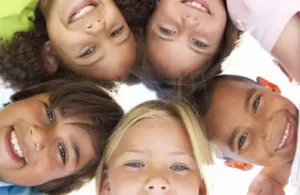 Language Kids World-group of kids in circle looking down