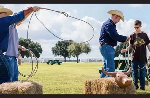 Kids learning to lasso at George Ranch Historical Park