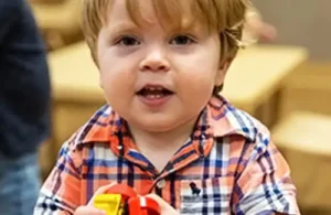 Small child learning and discovering at Childtime Learning Centers; daycare summer camps