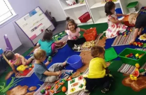 Distinct Abilities-kids sitting on floor during playing; academic program