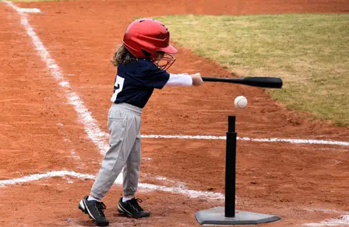 lil sluggers - kid hitting baseball off the tee