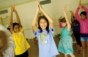 Main Street Theater; arms raised in class