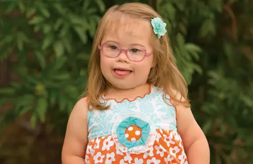 Smiling young girl with down syndrome