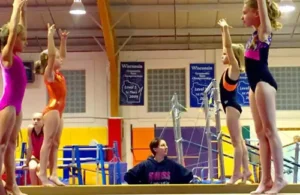 Westwood Gymnastics and Dance; girls practicing on the balance beam; ballet dance gymnastics camps