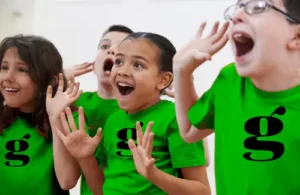 Kids singing in group performance at A.D. Players Summer Theatre Camp.