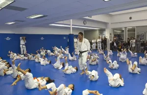 Cantu's Texas Jiu-Jitsu Self-Defense students in class laying on matte during instructions