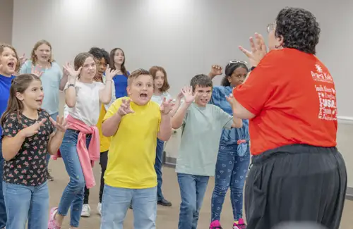 Group of kids practicing their acting skills during drama classes.