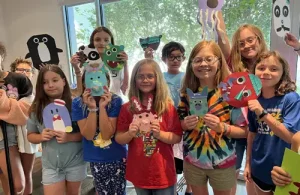 After School-Homeschool Art Classes Pearl Fincher summer camp kids showing off their crafts.