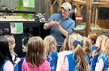 Girl scout troop being shown the rescued animals they have at the Houston Humane Society Wildlife Rescue Center TWRC.