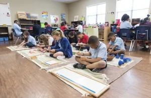 Silverline Montessori students in class doing activities on floor mats.