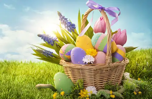 Easter basket filled with easter eggs and flowers sitting on grass; Easter activities and events 2025