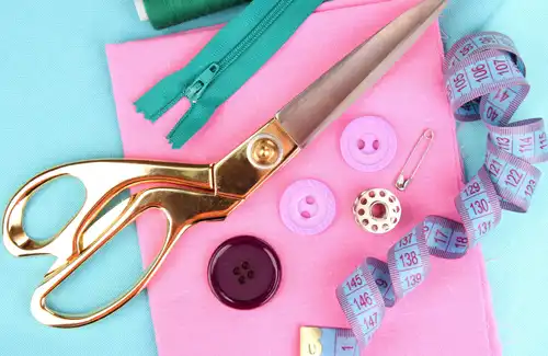 The Sewcial Box; One-of-a-kind sewing and quilting wonderland. Sewing accessories including scissors, buttons, measuring tape, and zipper.