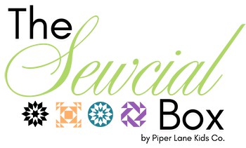 The Sewcial Box logo; One-of-a-kind sewing and quilting wonderland.