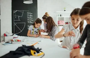 The Sewcial Box; One-of-a-kind sewing and quilting wonderland. Sewing students piecing together their project with instructor.