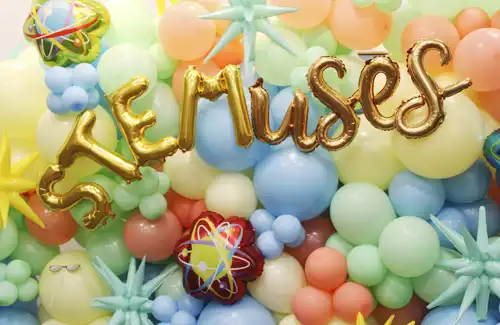 STEMuses balloon background spelling out STEMuses