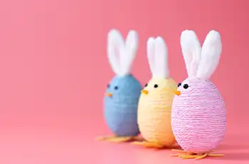 10 Fun and Easy Easter Crafts for Kids main image showing three crafted chicks of different color with bunny ears.
