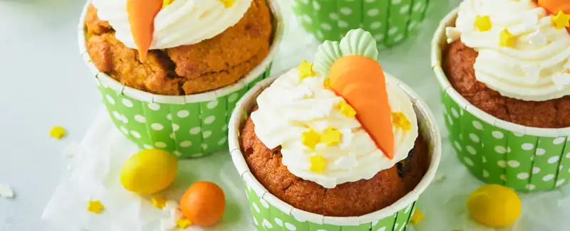 The Ultimate Easter Survival Guide for parents image showing carrot cake cupcakes.