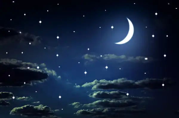 25 Screen Free Family Activities for All Ages blog article main image; night sky with clouds and a crescent moon.