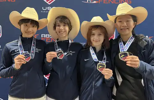 Alliance Fencing Academy students showing their medals.