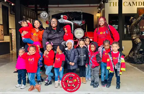 Family group standing for picture at the Houston Fire Museum.