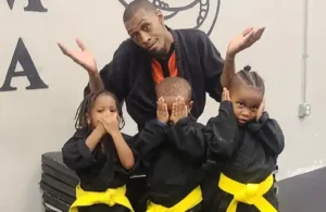 Students at Sensei's School of Martial Arts standing with sensei.