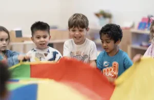 Children at Bezos Academy gathering and enjoying an activity together.