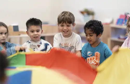 Children at Bezos Academy gathering and enjoying an activity together.